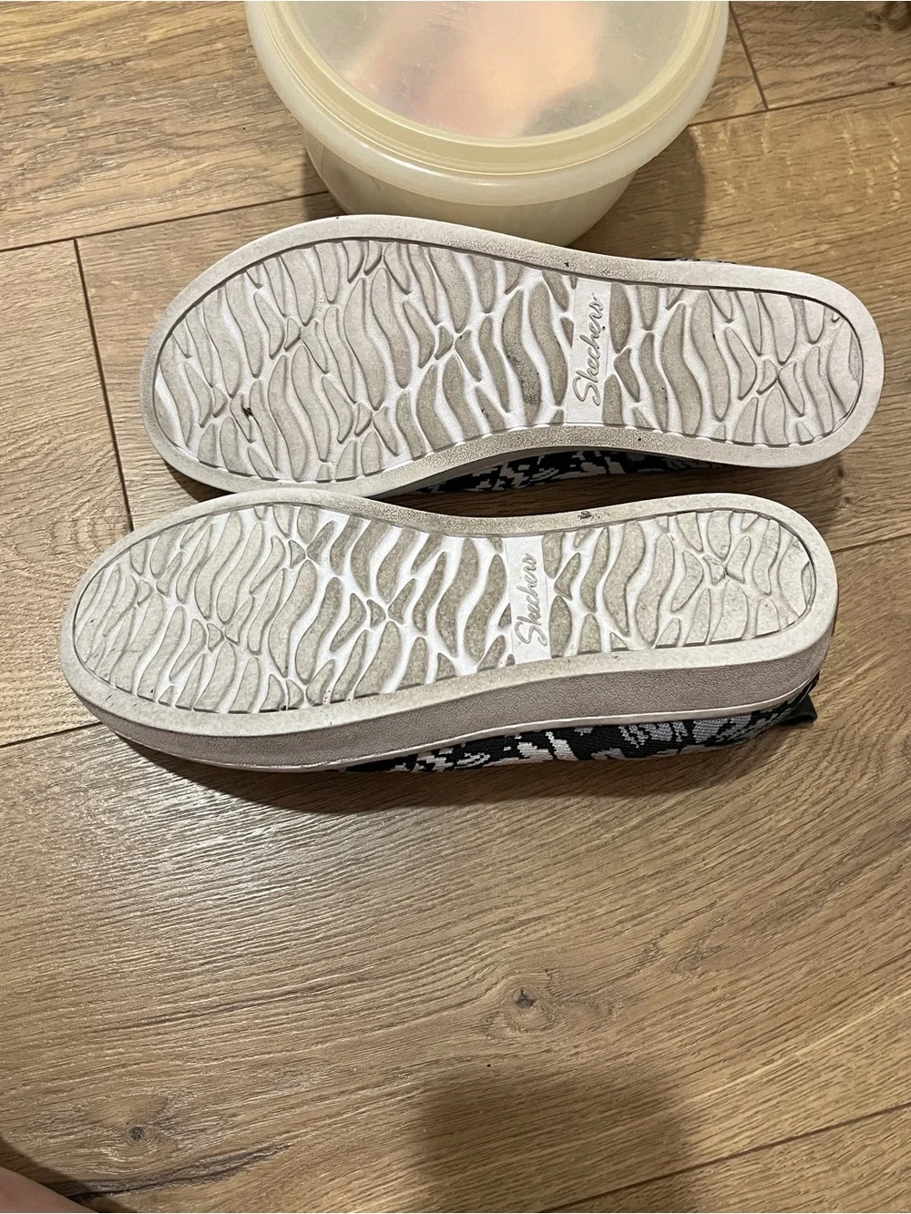 SkechersBlack & White Slip-On Knit Sneakers